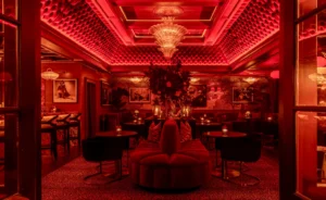 The glamorous new cocktail lounge Beaton’s at Bar Cecil in Palm Springs features lots of red velvet and moody lighting.